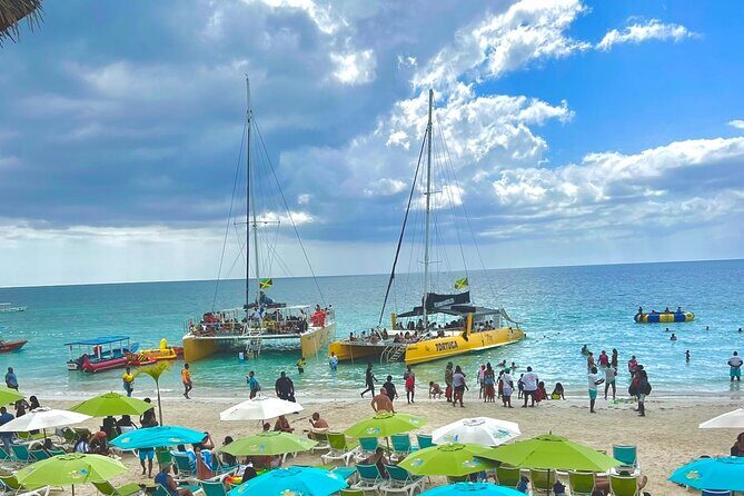 7 Mile Beach Party Catamaran Cruise with Snorkeling & Ricks Cafe - Key highlights you’ll feel right away