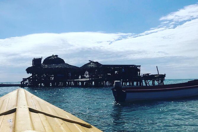 Appleton Rum Factory, Ys Falls, Black River Safari, Floyd’s Pelican Bar - Floyd’s Pelican Bar at sunset: the “ocean bar” experience that delivers