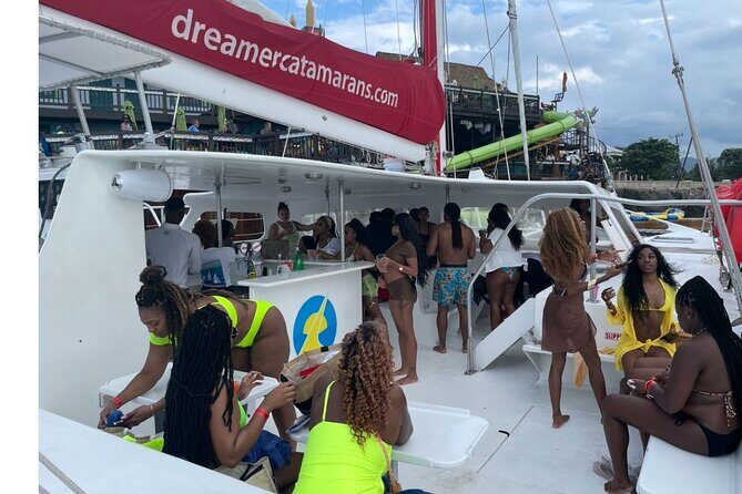 Bamboo Rafting, Catamaran Party Cruise and Snorkeling in Jamaica - Seven Mile Beach catamaran party cruise: open bar, music energy, and snorkeling time