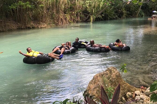 Blue Hole Adventurous and Relaxing River Tubing water Activities in Ocho Rios - Stop 1 at the Blue Hole: falls, cave time, and rope swing energy