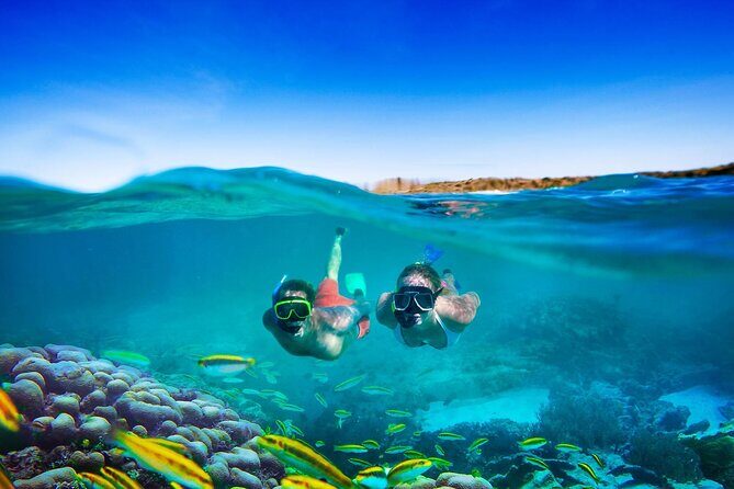 Catamaran Party Cruise and Snorkeling from Montego Bay - Doctor’s Cave Beach snorkeling: calm water + borrowed gear