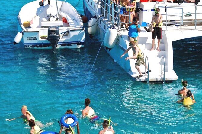 Catamaran Party Cruise and Snorkeling from Montego Bay - Margaritaville in the middle: slide time, inflatable fun, and lunch only if you want it