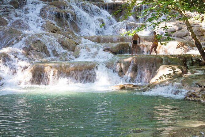 Dunn's River Falls & River Tubing with Lunch from Falmouth - Entering Dunn’s River Falls: 600 feet of stair-step fun