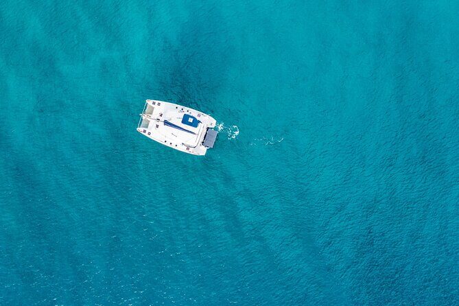 Family Catamaran Cruise from Jamwest Beach Negril Hotels - Rick’s Cafe at sunset: cliff divers, views, and weather reality