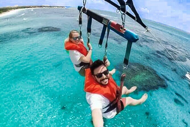 Parasailing above Turquoise Ocean Waters in Montego Bay - Getting Picked Up in Montego Bay: Calm Start, Clear Check-In