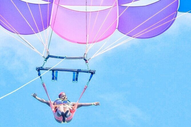 Parasailing, Blue Hole Mineral Spring, Seven Mile Beach - Seven Mile Beach Time: Swim, Snorkel, and Watch the Spring Show