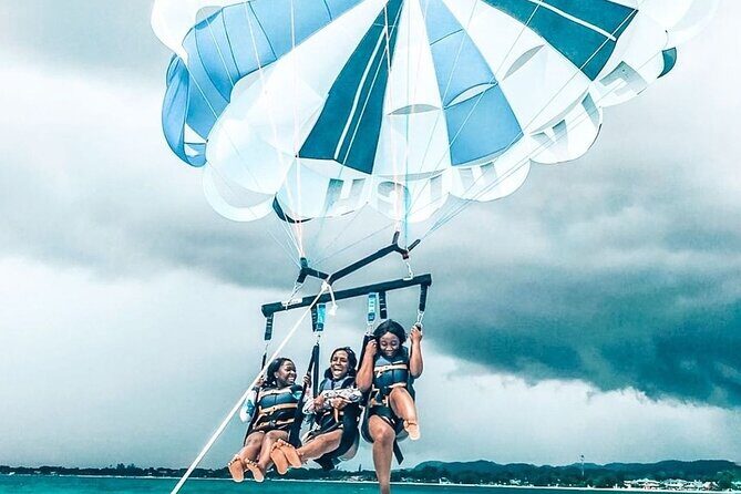Parasailing, Blue Hole Mineral Spring, Seven Mile Beach - Puerto Seco Beach and the Blue Hole Mineral Spring: Clean Water and Big Pools