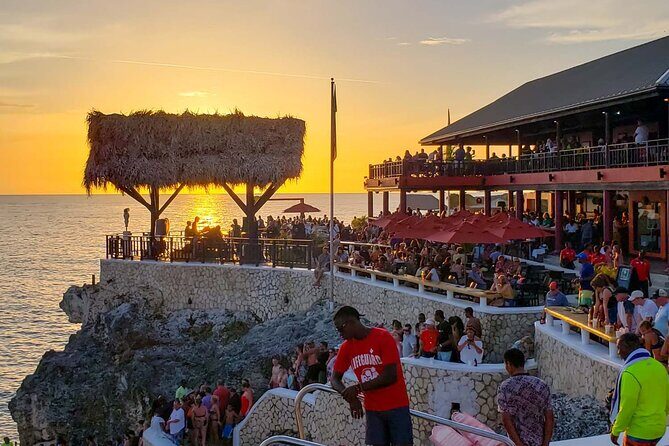 Private Seven Mile Beach and Rick’s Café Tour From Negril Hotels - Rick’s Café at Sunset: reggae, big views, and cliff leaps
