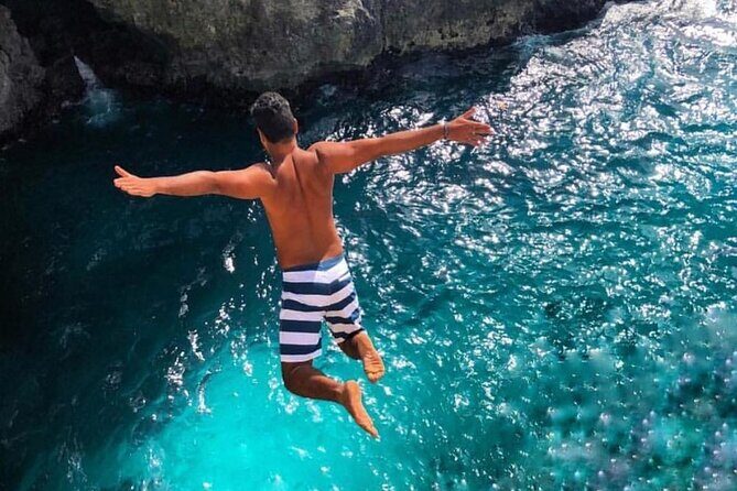 Private Tour Negril Beach and Rick's Cafe From Montego Bay - Rick’s Cafe Cliff Views and Reggae Atmosphere