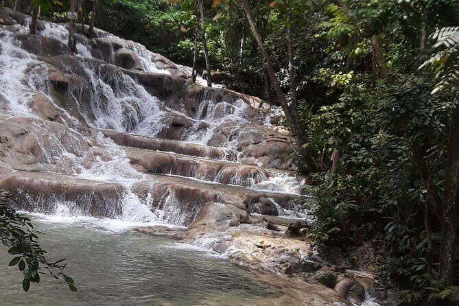 Private Tour to Dunn's River Falls From Ocho Rios - Entering Dunn’s River Falls: wrist band, sandy start, big climb