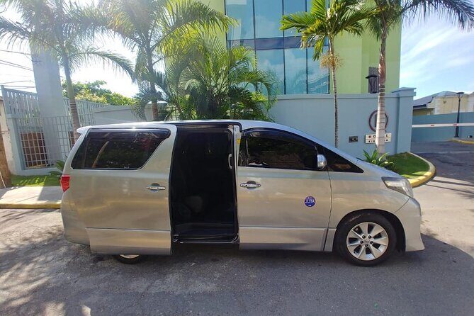 Private Transfer From Norman Manley Airport to Kingston one way - Finding Your Driver Fast: The Name Sign + Busy-Jacket Look