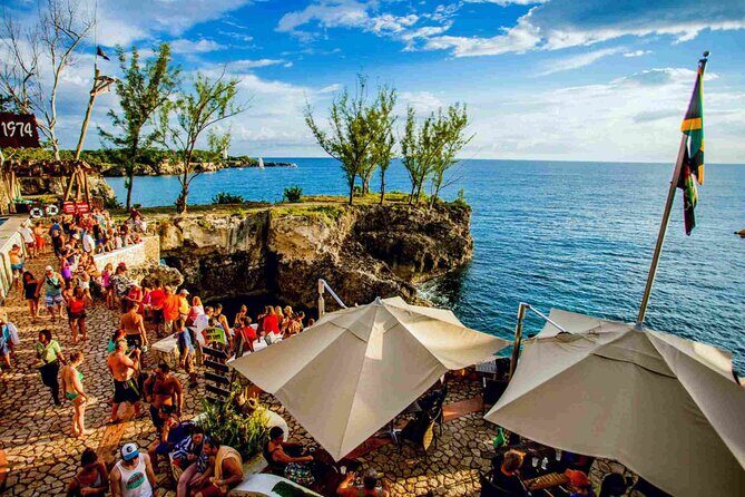 Rick s Café and Seven Mile Beach Private Tour Negril Jamaica - Seven Mile Beach time: white sand, easy swimming, and beach-bar energy