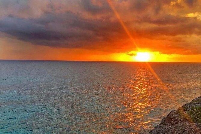 Rick's Café and Seven Mile Beach Private Tour - Rick’s Cafe: reggae, food, and the famous cliff-jumping show
