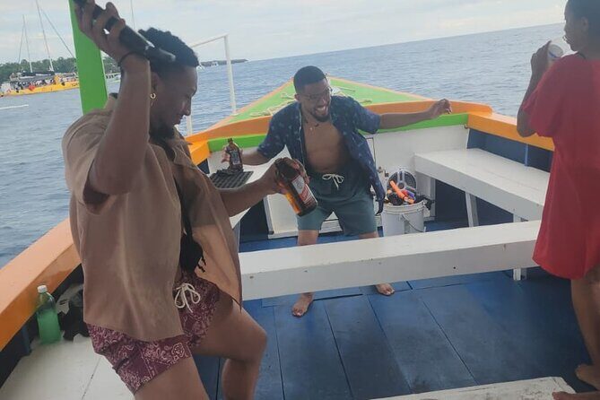 Sunset Booze Cruise in Negril - On-water party pacing: drinks, Jell-O shots, and music