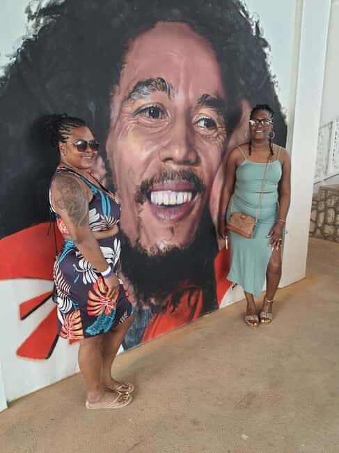 The Official Nine Mile Bob Marley Museum Guided Tour - Colorful murals and documentary moments that connect the dots